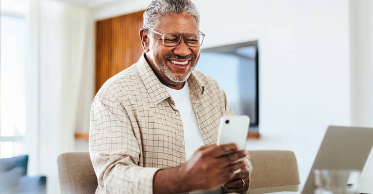Man Happy Looking At His Phone