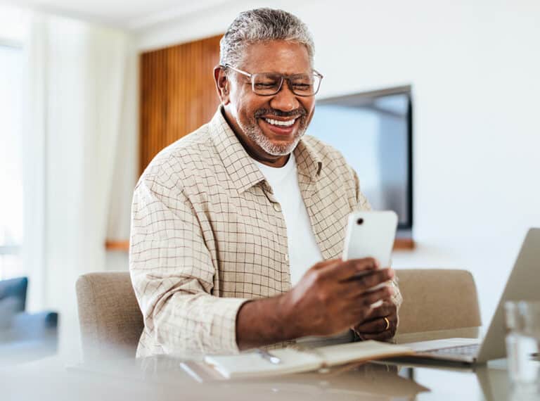 Man Happy Looking At His Phone