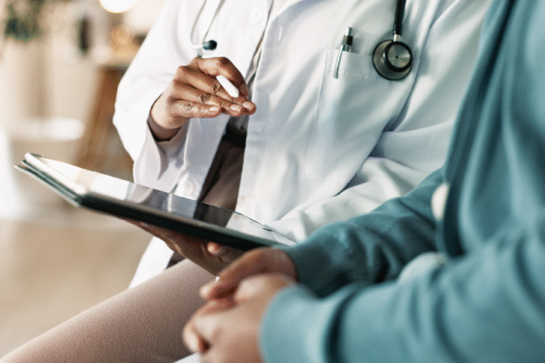 Doctor showing a patient something on their IPad