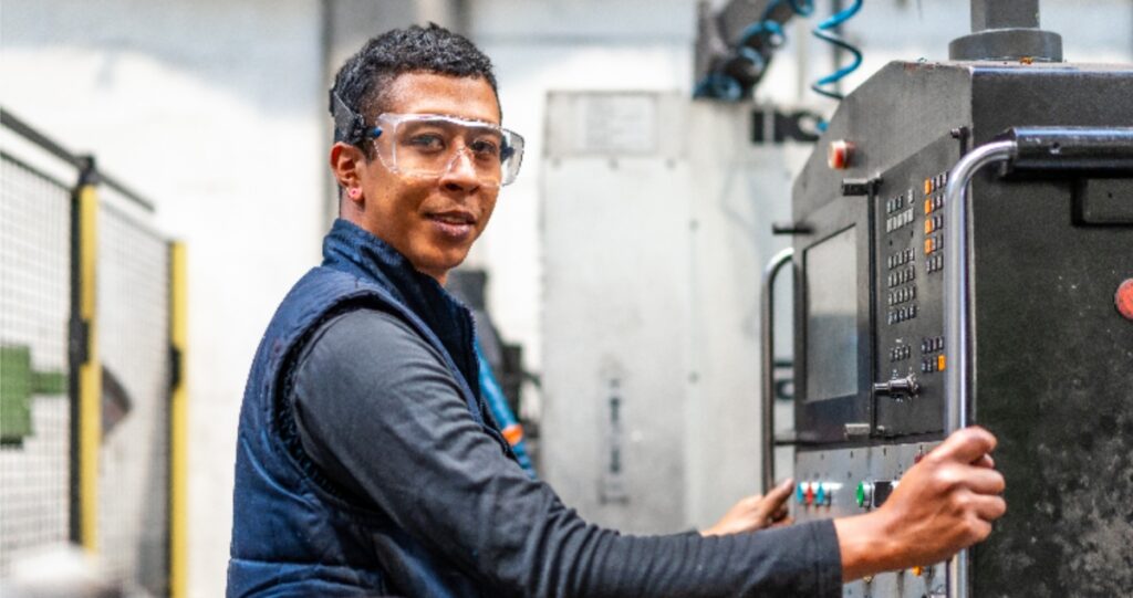 industrial worker smiling into the camera