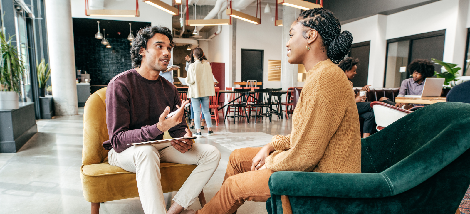 Two professionals engaging in conversation for an interview