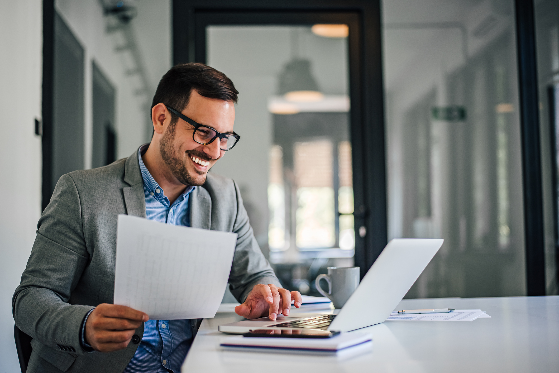 Portrait of young smiling cheerful entrepreneur