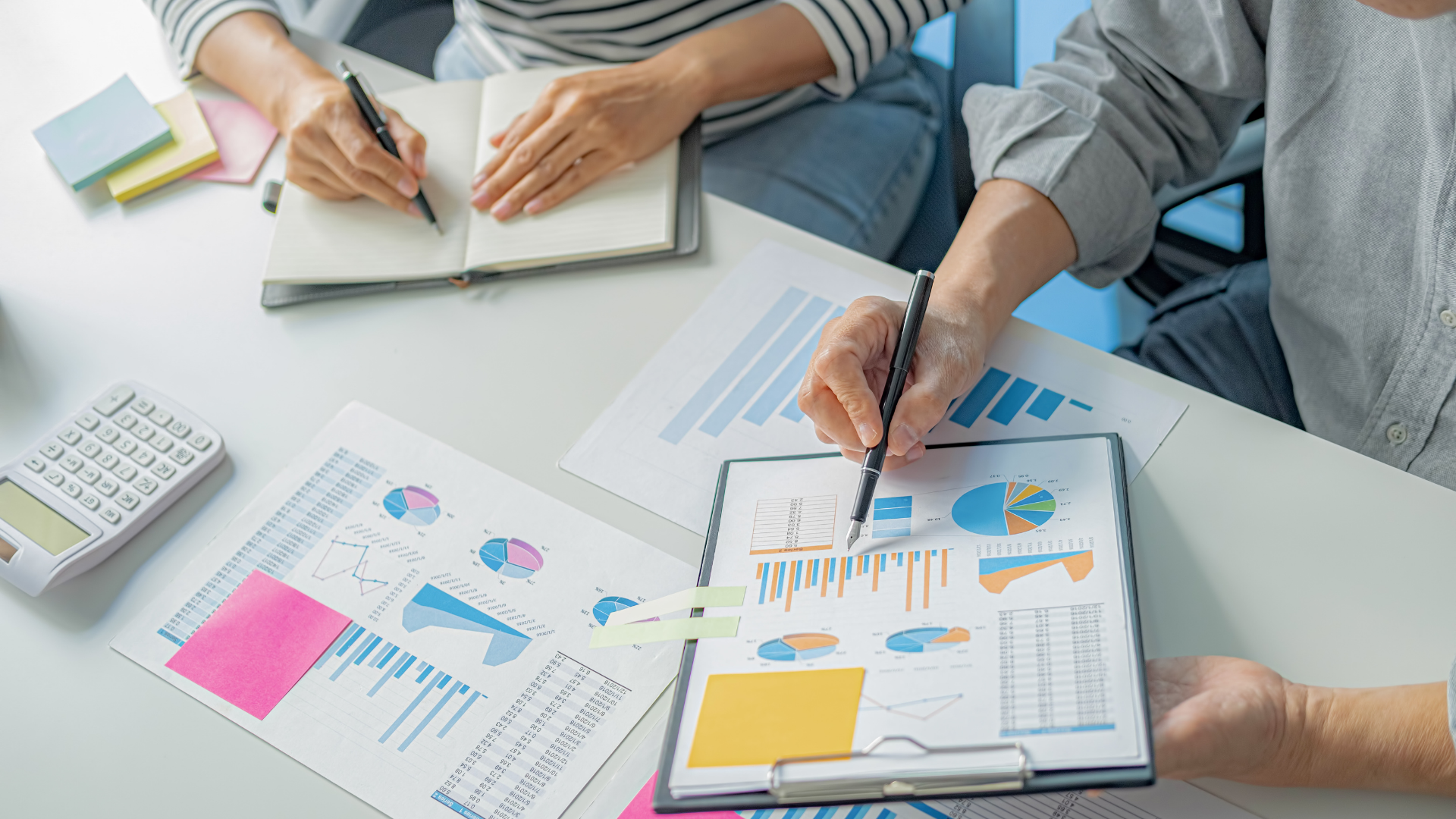 Picture of two individuals going over analytics