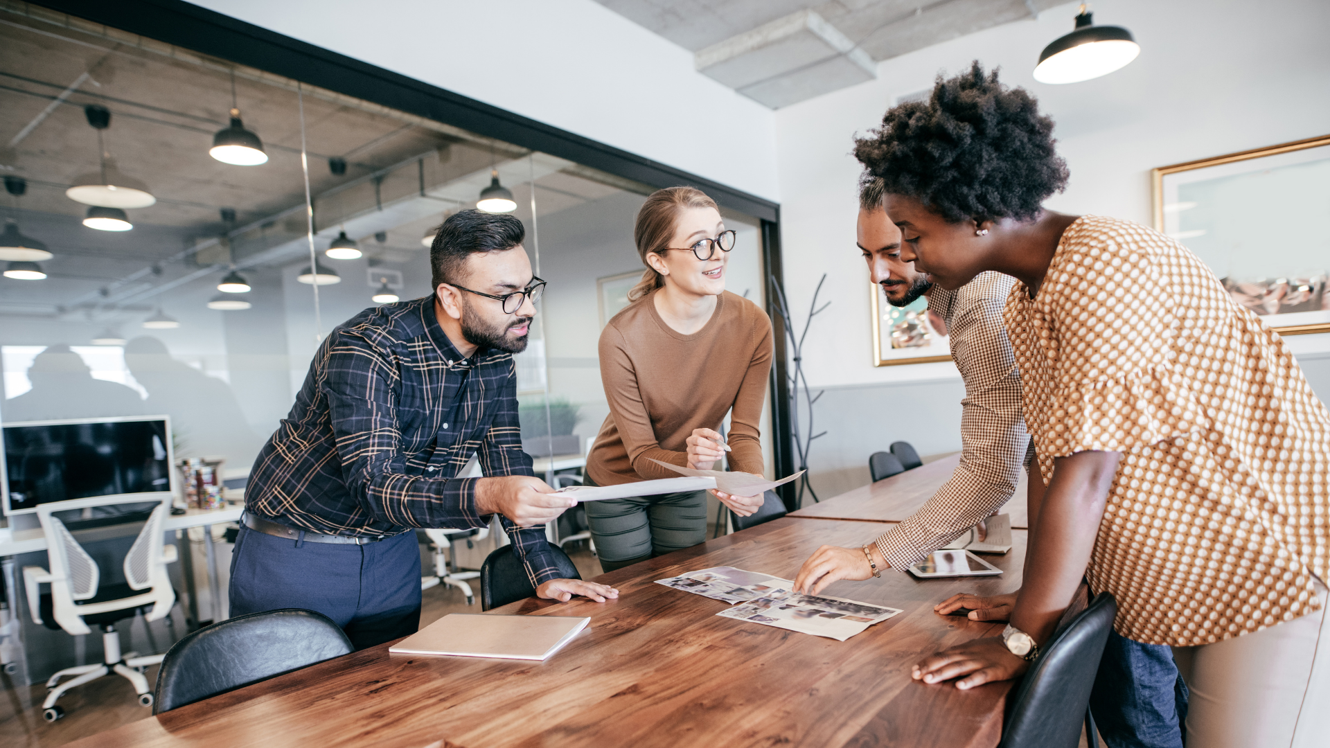 Team members working together around a table on a project