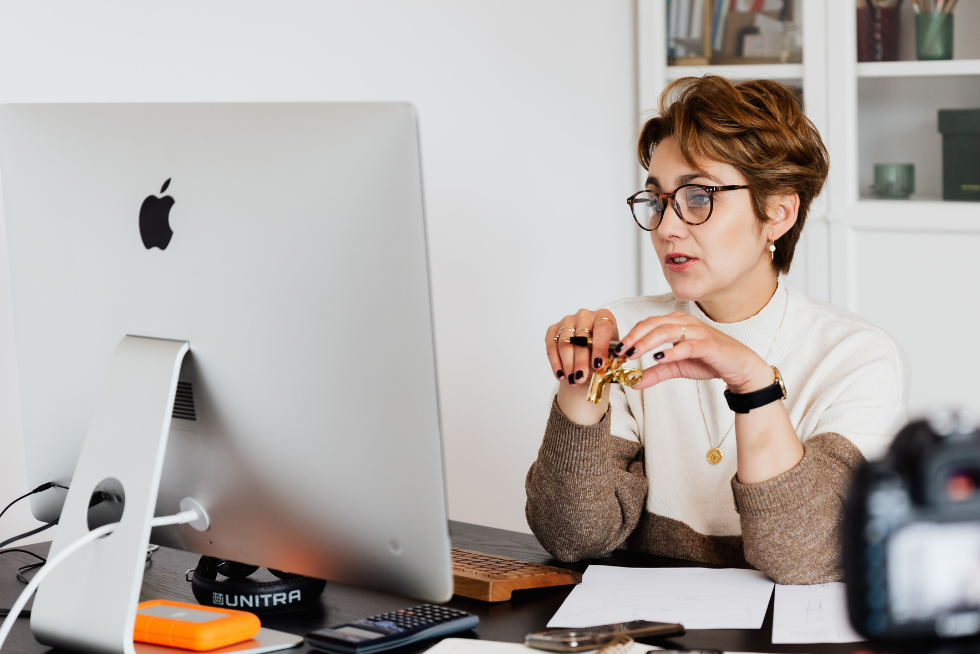 Employee watching an informative webinar on her desktop computer